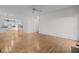 Expansive living room flows into a kitchen featuring hardwood floors and ample space at 2309 Clerestory Pl, Raleigh, NC 27615