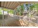 Relaxing screened porch with wood flooring and views of the private backyard at 2309 Clerestory Pl, Raleigh, NC 27615