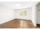 Bright, empty bedroom with hardwood floors and large window offering natural light at 2509 Elderwood Ln, Burlington, NC 27215