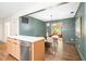 Open-concept kitchen, seamlessly connecting to the dining room, featuring stainless steel appliances and an island at 2509 Elderwood Ln, Burlington, NC 27215