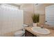 This bathroom includes a single sink with a shower/tub behind a light curtain, and a toilet at 274 Tuscarora Ln, Clayton, NC 27520