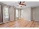 This bedroom has hardwood laminate floors, a ceiling fan, and lots of natural light through the two bright windows at 274 Tuscarora Ln, Clayton, NC 27520