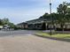 Community clubhouse with ample parking and adjacent playground at 274 Tuscarora Ln, Clayton, NC 27520