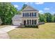 Charming two story home with a two car garage, level yard, and beautiful landscaping at 274 Tuscarora Ln, Clayton, NC 27520