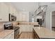 Bright kitchen with granite countertops, stainless appliances, and a center island at 274 Tuscarora Ln, Clayton, NC 27520