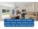 Modern kitchen featuring an island, stainless steel appliances, and ample counter space at 274 Tuscarora Ln, Clayton, NC 27520