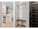 A mud room nook includes hooks and a shelf with an entrance to the kitchen at 274 Tuscarora Ln, Clayton, NC 27520