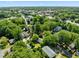 Aerial view of neighborhood featuring homes and mature trees at 301 N West St St, Cary, NC 27513
