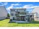 A spacious backyard with a deck and patio area perfect for outdoor entertainment at 312 Grassy Point Rd, Apex, NC 27502