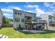 A spacious backyard with a deck and patio area perfect for outdoor entertainment at 312 Grassy Point Rd, Apex, NC 27502