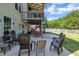 A lovely backyard patio area is perfect for relaxing and enjoying the outdoors at 312 Grassy Point Rd, Apex, NC 27502