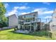 A spacious backyard with a deck and patio area perfect for outdoor entertainment at 312 Grassy Point Rd, Apex, NC 27502