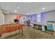 Finished basement is an entertainment haven with foosball, air hockey, and a TV for endless recreation at 312 Grassy Point Rd, Apex, NC 27502