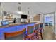 Entertainment basement boasting a stylish bar with modern lighting and hardwood floors for a vibrant social atmosphere at 312 Grassy Point Rd, Apex, NC 27502