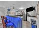 Finished basement showcasing a wet bar, stainless steel fridge, and sleek countertops for the ultimate entertaining space at 312 Grassy Point Rd, Apex, NC 27502