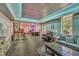 Bright finished basement with an exercise area, recreation space, a sofa, and a television, making it perfect for entertaining at 312 Grassy Point Rd, Apex, NC 27502