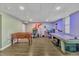 This fully equipped basement boasts games, a desk, and entertainment, perfect for relaxing or working from home at 312 Grassy Point Rd, Apex, NC 27502