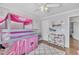 A bright bedroom features wood floors, a loft bed, and neutral paint at 312 Grassy Point Rd, Apex, NC 27502