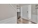 Bright foyer with hardwood floors, decorative furnishings, and a staircase creates an inviting entrance at 312 Grassy Point Rd, Apex, NC 27502
