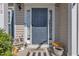 Inviting front entry boasts a blue door, sidelights, and stylish decor for a warm welcome at 312 Grassy Point Rd, Apex, NC 27502