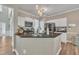 Modern kitchen features granite countertops, stainless steel appliances, and ample cabinet space at 312 Grassy Point Rd, Apex, NC 27502