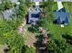 Bird's eye view of a home with solar panels, mature trees, and a well-maintained lawn at 3627 River Watch Ln, Franklinton, NC 27525
