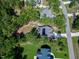 Aerial view of the property highlighting the home's location surrounded by mature trees at 3627 River Watch Ln, Franklinton, NC 27525