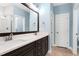 Bathroom featuring double sinks with a long vanity and modern fixtures at 3627 River Watch Ln, Franklinton, NC 27525
