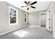Spacious bedroom with large windows and a ceiling fan for added comfort at 3627 River Watch Ln, Franklinton, NC 27525