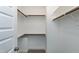 Walk-in closet with wooden rods providing ample storage space at 3627 River Watch Ln, Franklinton, NC 27525