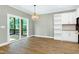 Bright dining room features access to the backyard and white cabinets at 3627 River Watch Ln, Franklinton, NC 27525