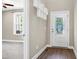 Home entryway showcasing decorative front door, adjacent living space and hardwood flooring at 3627 River Watch Ln, Franklinton, NC 27525
