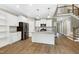 Modern kitchen with white cabinetry, stainless steel appliances, and a spacious island at 3627 River Watch Ln, Franklinton, NC 27525