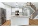 Bright kitchen features stainless appliances, granite counters and white cabinets at 3627 River Watch Ln, Franklinton, NC 27525