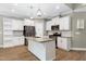 Bright kitchen features stainless appliances, granite counters and white cabinets at 3627 River Watch Ln, Franklinton, NC 27525