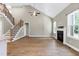 Spacious living room with fireplace and staircase at 3627 River Watch Ln, Franklinton, NC 27525