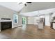 Open living room featuring a fireplace, backyard access, and adjacent kitchen at 3627 River Watch Ln, Franklinton, NC 27525