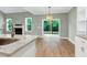 Open-concept living room with a fireplace and access to the backyard at 3627 River Watch Ln, Franklinton, NC 27525