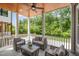 Relaxing back porch with comfortable seating, a ceiling fan, and wooded views at 3932 Old Chapel Hill Rd, Durham, NC 27707