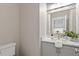 Modern half-bathroom with updated vanity, neutral wall color, and stylish mirror at 3932 Old Chapel Hill Rd, Durham, NC 27707