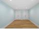 Finished basement featuring neutral paint and trim, and wood-look laminate flooring at 3932 Old Chapel Hill Rd, Durham, NC 27707