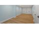 Finished basement featuring neutral paint and trim, and wood-look laminate flooring at 3932 Old Chapel Hill Rd, Durham, NC 27707