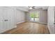 Finished basement featuring neutral paint, trim, doors to storage and french doors to the outside at 3932 Old Chapel Hill Rd, Durham, NC 27707