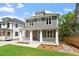 Two-story gray home with manicured front lawn, covered porch, and welcoming blue door at 3932 Old Chapel Hill Rd, Durham, NC 27707