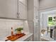 Chic kitchen with marble countertops, stylish cabinetry, and hardwood floors at 3932 Old Chapel Hill Rd, Durham, NC 27707
