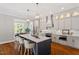 Modern kitchen with large island, stainless steel appliances, and ample counter space at 3932 Old Chapel Hill Rd, Durham, NC 27707