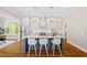 Modern kitchen with a spacious island, stainless steel appliances, and pendant lighting at 3932 Old Chapel Hill Rd, Durham, NC 27707