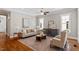 Comfortable living room with ample seating, hardwood floors, and natural light at 3932 Old Chapel Hill Rd, Durham, NC 27707