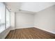 Empty bedroom with hardwood floors and large windows offering plenty of light at 400 W North St # 814, Raleigh, NC 27603