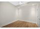Empty room with hardwood floors, ceiling fan and modern fixtures and trim at 400 W North St # 814, Raleigh, NC 27603